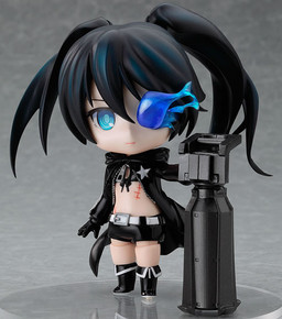nendoroid of black rock shooter, released in 2010. she has black hair, cut unevely and tied up in twintails unevenly, and blue eyes. she wears small black shorts, high black boots, and a large black jacket.