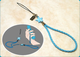replica charm of mato's from the black rock shooter ova. it's a light blue braided phone strap with a small blue star.