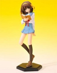 a mini figure of haruhi suzumiya from the melancholy of haruhi suzumiya. she wears a blue and white seifuku with a red arm band that says director on it, and has medium-length brown hair and brown eyes. she wears a smug smirk, a marigold headband with twin ribbons on either side of it, and is holding a book.