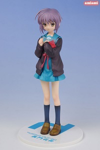 a scale figure of nagato yuki from the melancholy of haruhi suzumiya. she wears a blue and white seifuku with a brown cardigan, and has short, light-purple hair and brown eyes. she bears no expression, a key trait of hers.